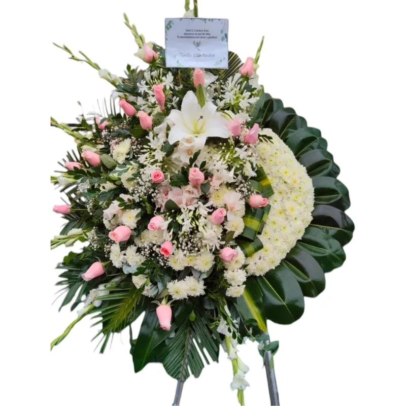 Corona fúnebre standar de 1.80 de alto. Elaborado con rosas rosadas importadas, hortensia, gladiolos, lilium, pompo y follaje