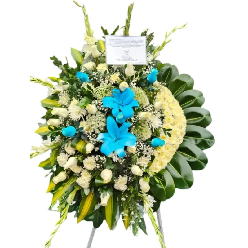 Corona fúnebre de 2m de alto, elaborada con 18 rosas blancas importadas, hortensia, gladiolos, lilium blanco, pompo y follaje
